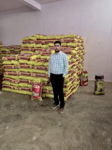 Amaze International's Founder with Rice Bags